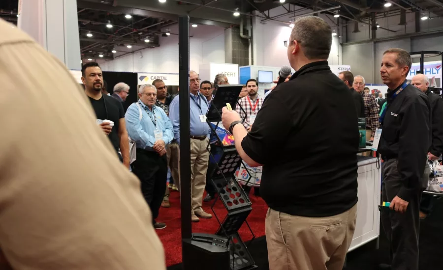 Contractors flock around the FLIR booth in hopes of winning tools during the 2017 AHR Expo in Las Vegas