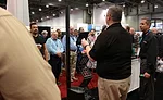 Contractors flock around the FLIR booth in hopes of winning tools during the 2017 AHR Expo in Las Vegas