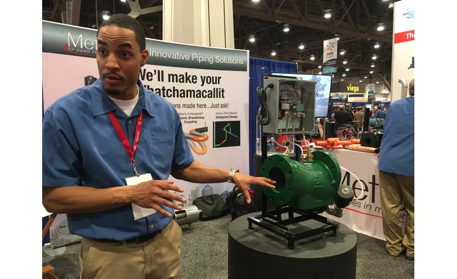 Metraflex Co. Product Manager Jeremy Wright showcases the style ABD strainer at the 2017 AHR Expo in Las Vegas