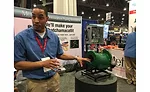 Metraflex Co. Product Manager Jeremy Wright showcases the style ABD strainer at the 2017 AHR Expo in Las Vegas