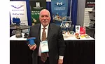 Milwaukee Valve’s Joe Myers poses with the MS Insulator valve handle during the 2017 AHR Expo in Las Vegas