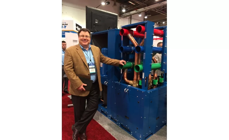Waterfurnace Intl.’s Alan Niles showcases the WC Dual Scroll Chiller, which can heat and cool simultaneously, during the 2017 AHR Expo in Las Vegas