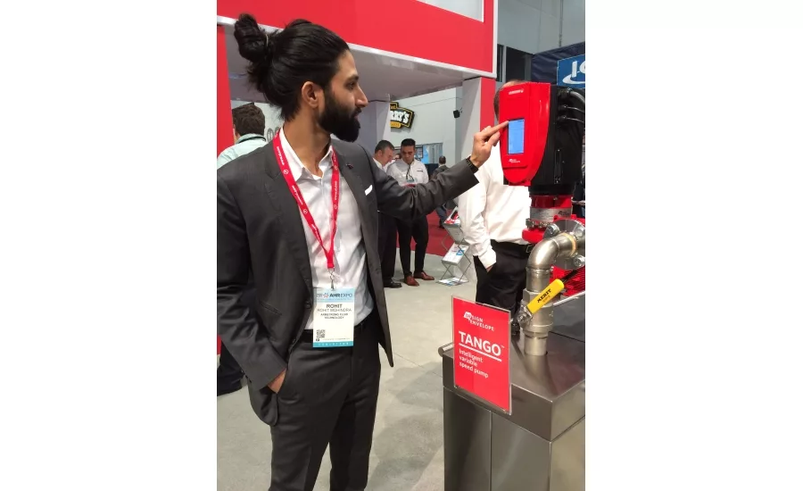 Armstrong Fluid Technologies’ Rohit Mohindra demonstrates the company’s new Design Envelope Tango Pump at the 2017 AHR Expo in Las Vegas