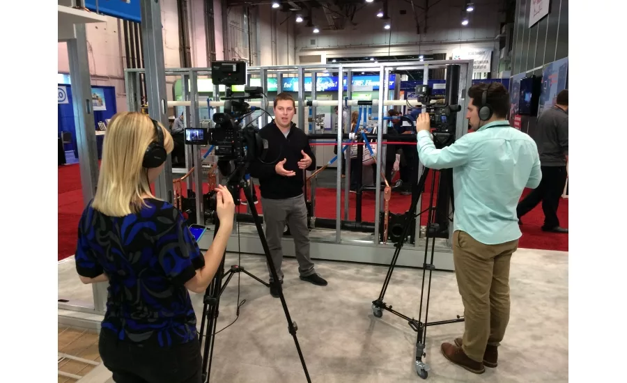 Uponor’s Daniel Worm films a video booth tour with BNP Media’s video team at the 2017 AHR Expo in Las Vegas