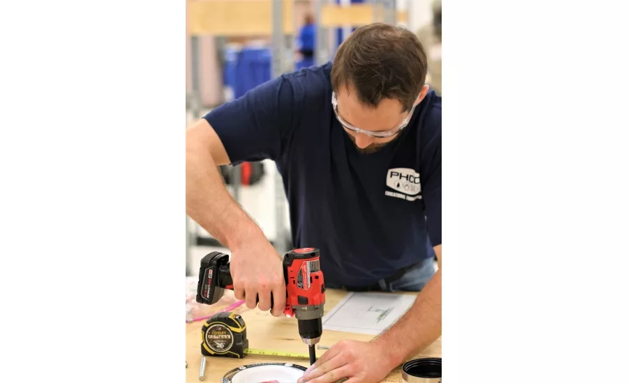 Twenty plumbing apprentices