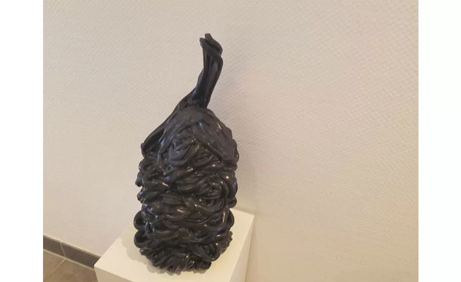 Art with pipe, displayed outside the Aquatherm kitchen and dining area