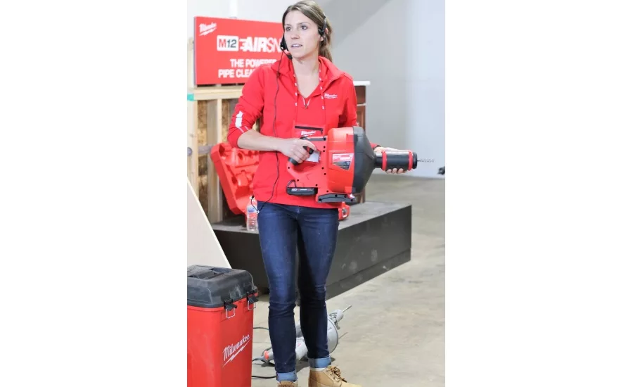 Product Manager Jacki Beierle demonstrates the M18 FUEL Drain Snake at Milwaukee Tool
