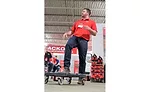 Senior Product Manager Matt Vargo steps on a dolly –a new product from Milwaukee Tool