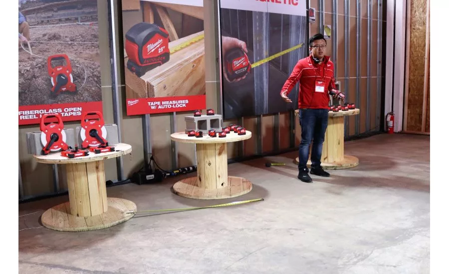 Product Manager James Wang demonstrates the durability of Milwaukee Tool’s STUD Tape measure