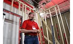 Associate Product Manager Garrett Schoonover demonstrates the extendable REDSTICK levels for framing applications