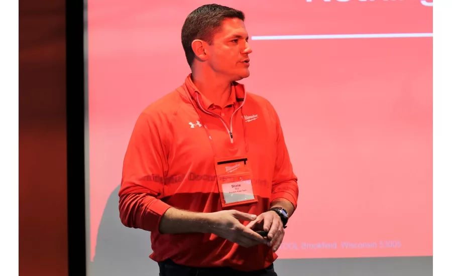 Shane Moll, president of power tools, speaks to contractors and the media about the company