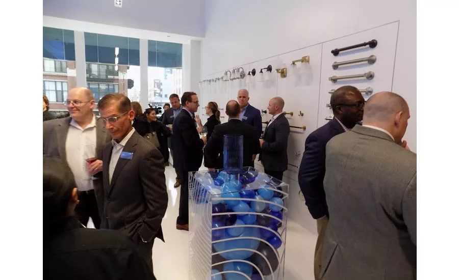 The wall of Moen bathroom accessories was a popular spot to mingle during the grand opening event