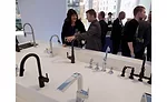 Visitors to check out one of the multiple rows of working Moen faucets