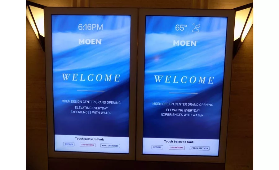 A welcome sign to the grand opening celebration for the new Moen showroom