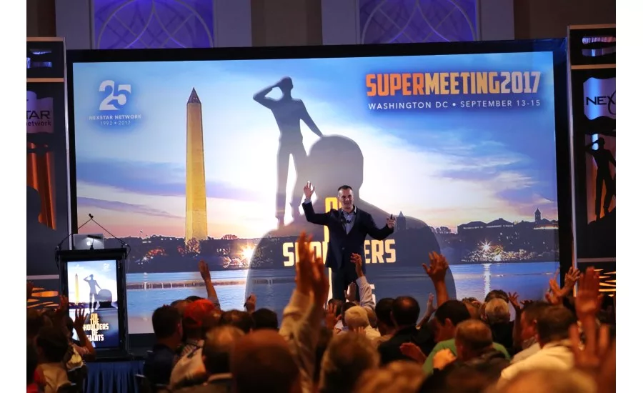 Many hands go up as Chris Mursau, vice president of Topgrading