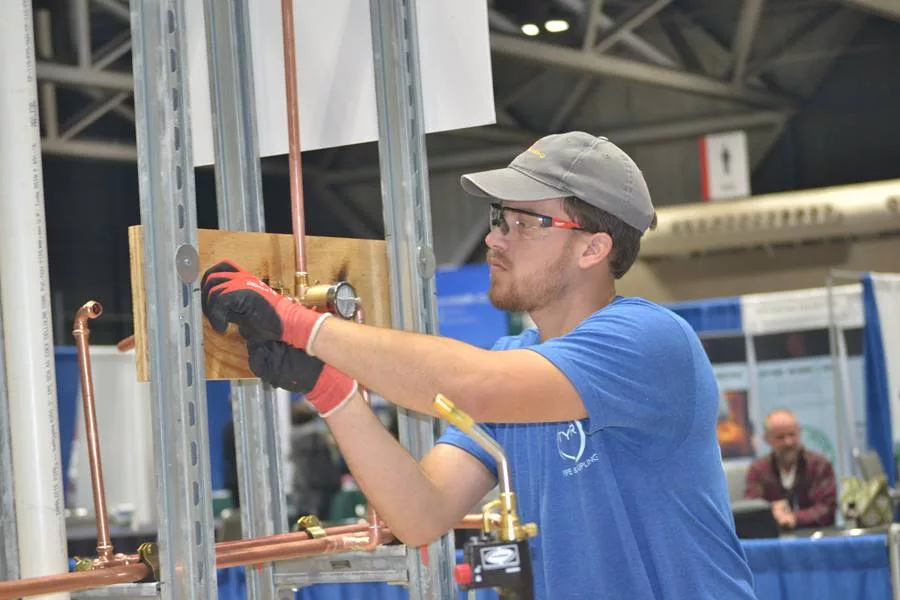 An apprentice competes in the Plumbing Apprentice Contest