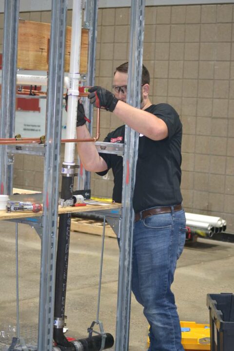An apprentice competes in the Plumbing Apprentice Contest