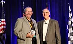 Joe Cunningham receives the inaugural Consultant of the Year award during Service World Expo in Las Vegas