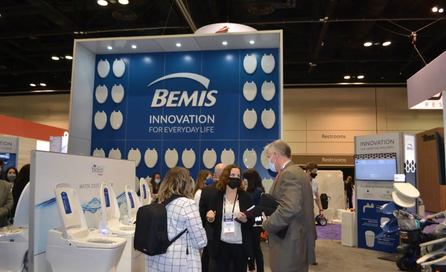 Bemis’ Mirjam Lippuner gives BNP Media Plumbing Group a booth tour at KBIS 2022.