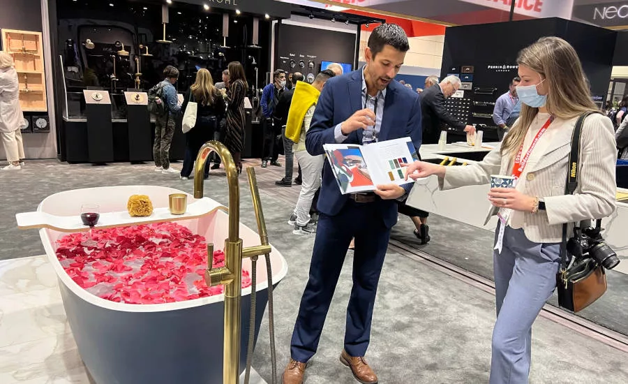 Justin Storm, House of Rohl’s group product manager, shows Supply House Times Chief Editor Natalie Forster some of the latest style and color trends