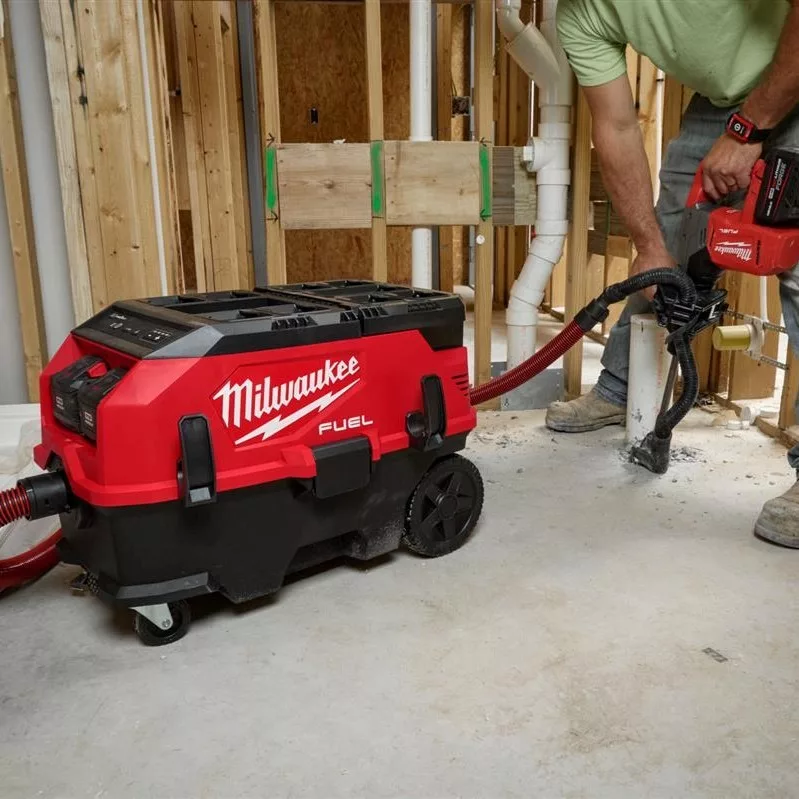 The Milwaukee M18 FUEL 9 Gallon Dual Battery Dust Extractor on a jobsite.