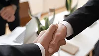 Airo Mechanical Adds Legrande’s Enterprises to Its Growing Business Two people shaking hands.