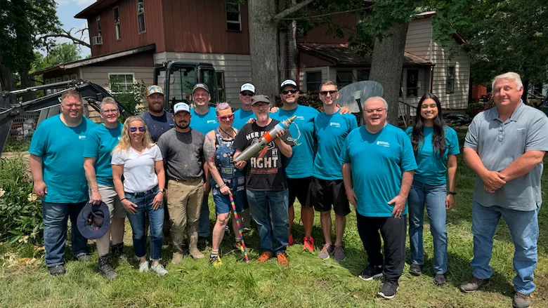 A woman holding a glass of clean water. 