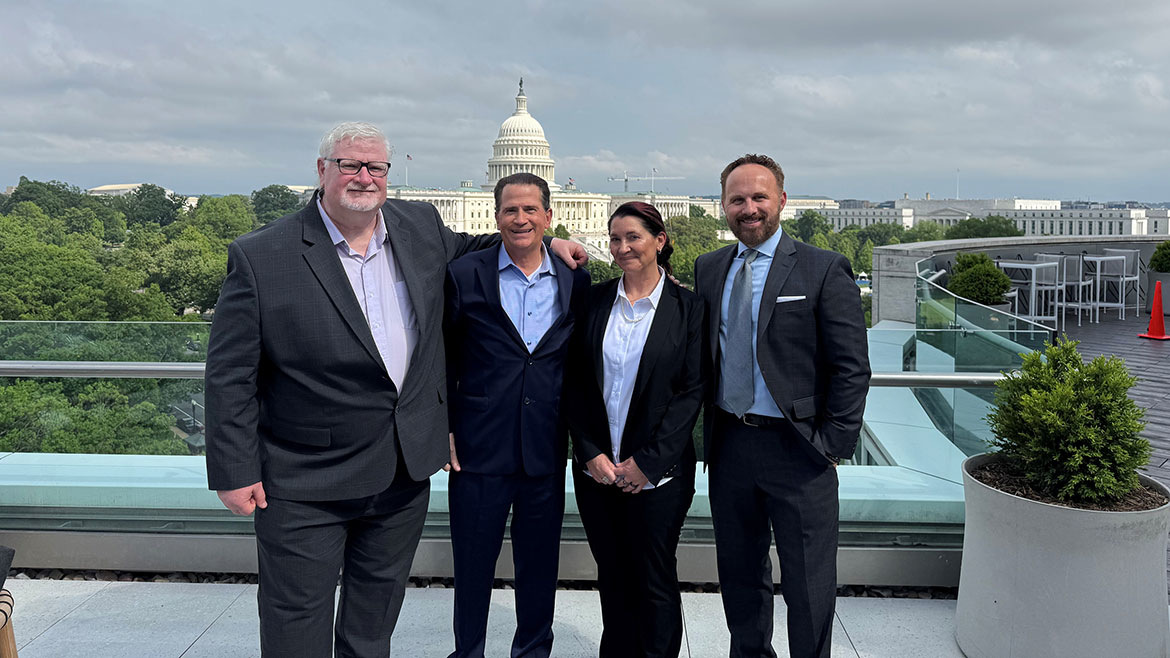 On the IAPMO HQ Deck: (right to left): Dain Hansen, Exec VP, Govt Affairs IAPMO, Barb Donaldson of Plastic Pipe and Fittings Association (PPFA), Dan Ashenden, and John Mesenbrink of Mechanical Hub - with our Capitol in the background.