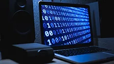 A computer screen showing a sequence of 0s and 1s. 