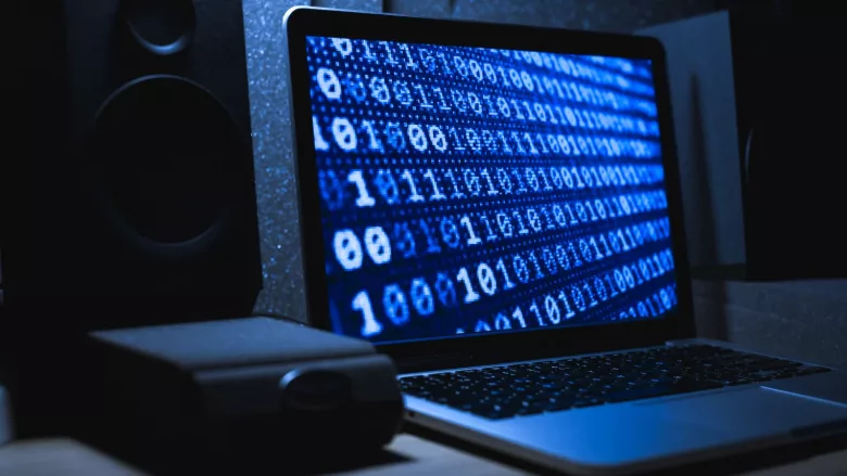 A computer screen showing a sequence of 0s and 1s. 