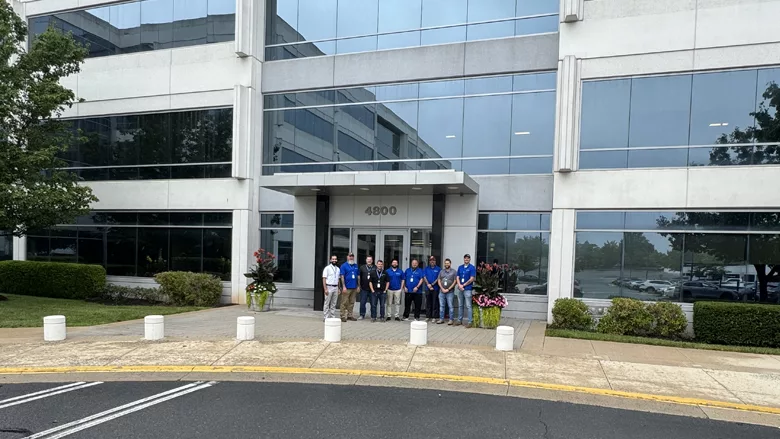Some members of Henerson Companies in front of the new building in DC.  