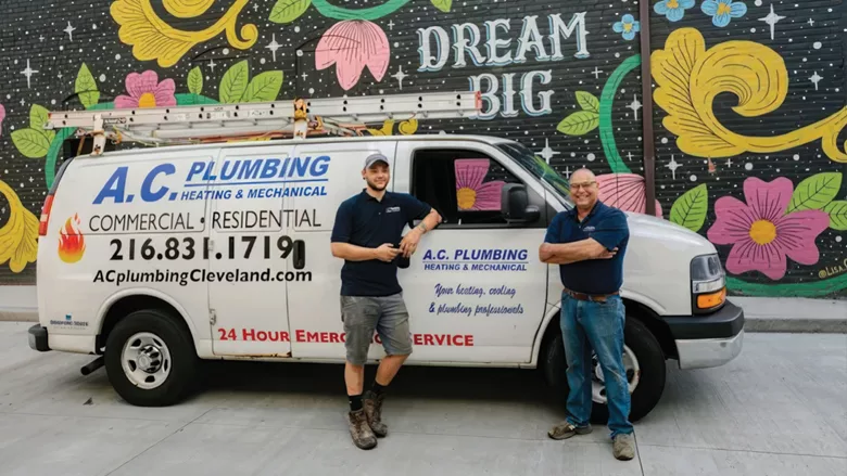 Michael and Anthony Caruso in front of the truck for A.C. Plumbing, Heating and Mechanical.