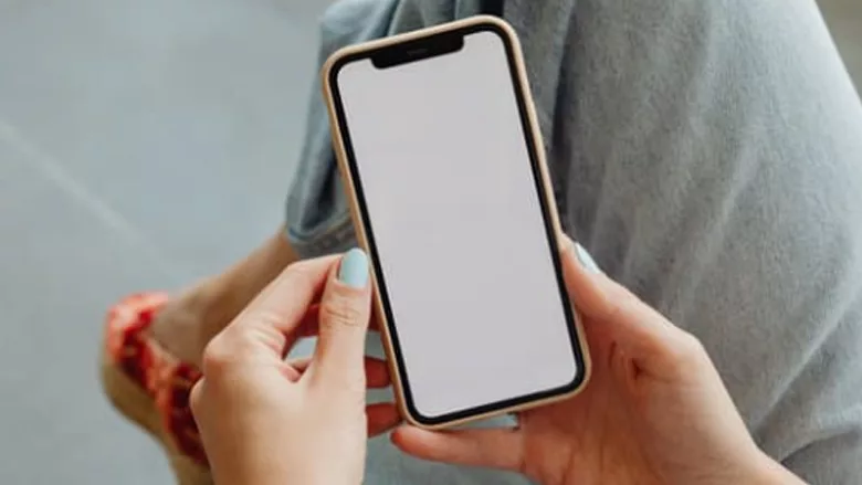 A person holding an iPhone.