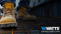 A pair of boots with the Watts logo.