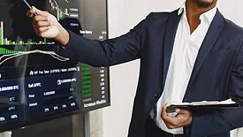 A business owner going over charts. 