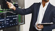 A business owner going over charts. 