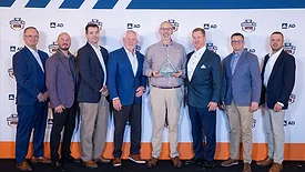 The Macomb Group team accepting the award. 