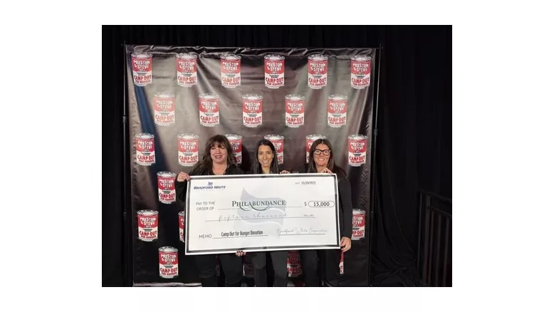 The Bradford White team posing with a check made out to Philabundance. 