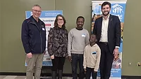 Rinnai partners with Habitat for Humanity Canada : New Habitat for Humanity Canada homeowner family, Noel and his son, celebrate with Habitat New Brunswick staff.