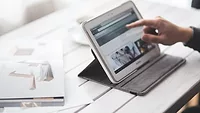 Keeping the trades human as technology expands A person using a tablet.