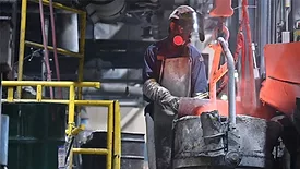 A person working at a manufacturing plant.