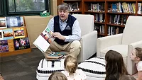Barton James, ACCA president and CEO, reads to a class of first graders in Little Rock, Arkansas in recognition of National Skilled Trades Day. 