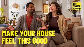 Two home-owners sitting on a couch, with "Make your house feel this good" and "The switch is on" written above them.