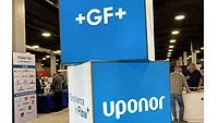 Rethinking How we Work Together at the GF Flow Symposium A display showing GF and Uponor's logos.