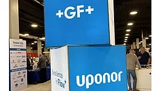 A display showing GF and Uponor's logos.