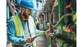Commercial outlook tech looking at pipes