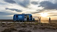 New Trimble Road Trip Reveals the Technology Powering America’s Infrastructure The Trimble branded airstream on the road, with a person recording it.