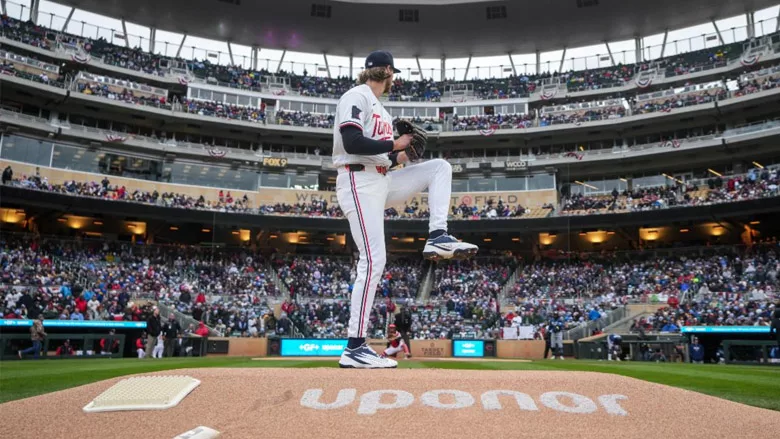 A baseball player preparing a pitch with "Uponor" written on the pitcher's mound.