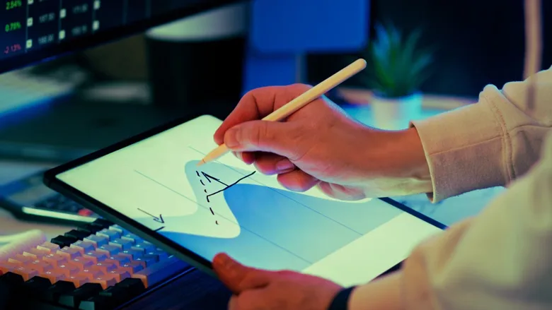 A woman using an iPad with a map.