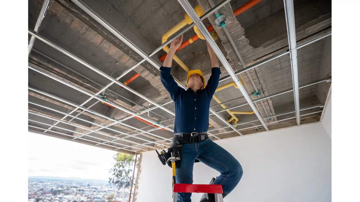 Technician working on pipes